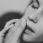 grayscale photo of womans face